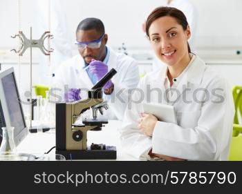 Technicians Carrying Out Research In Laboratory