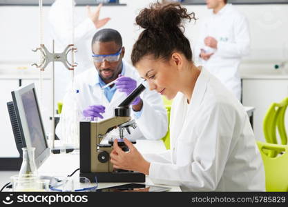 Technicians Carrying Out Research In Laboratory