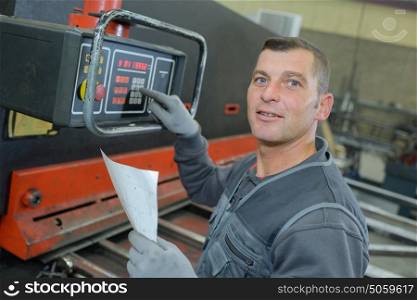 technicien using a electronic device in factory