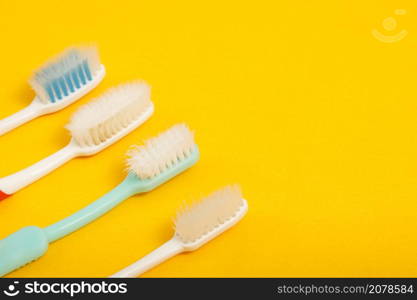 Techniques for storing toothbrushes and cleaning brushes after use to reduce the accumulation of germs and bacteria