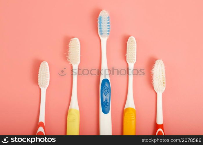 Techniques for storing toothbrushes and cleaning brushes after use to reduce the accumulation of germs and bacteria