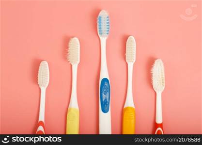 Techniques for storing toothbrushes and cleaning brushes after use to reduce the accumulation of germs and bacteria