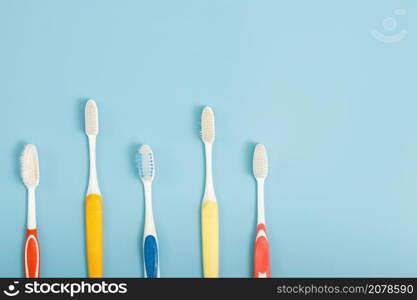 Techniques for storing toothbrushes and cleaning brushes after use to reduce the accumulation of germs and bacteria