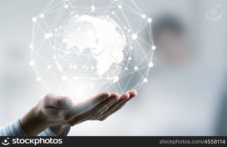 Technologies connecting the world. Global connection concept with digital planet in hands