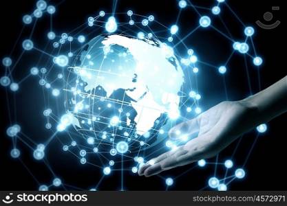 Technologies connecting the world. Global connection concept with digital planet in hands
