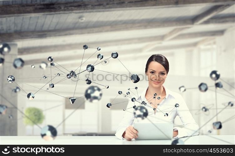 Technologies for work and connection. Attractive elegant woman at table in modern interior. Mixed media