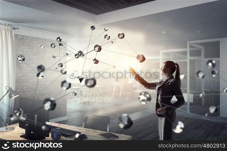 Technologies for work and connection. Attractive elegant woman touching connection concept in modern interior. Mixed media