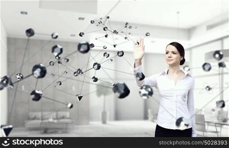 Technologies for work and connection. Attractive elegant woman touching connection concept in modern interior. Mixed media