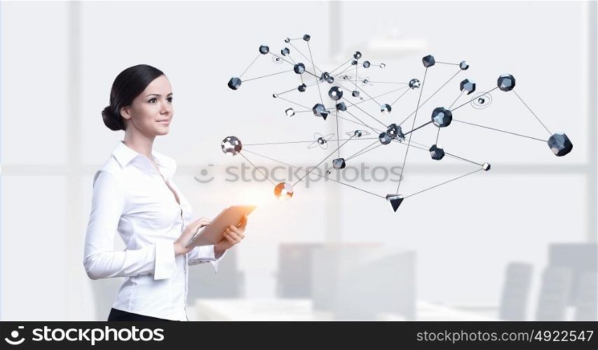 Technologies for work and connection. Attractive elegant woman with tablet pc in modern interior. Mixed media