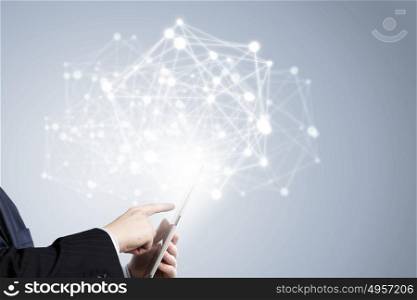 Technologies that conncet the world. Businessman holding in hand tablet with global connection concept