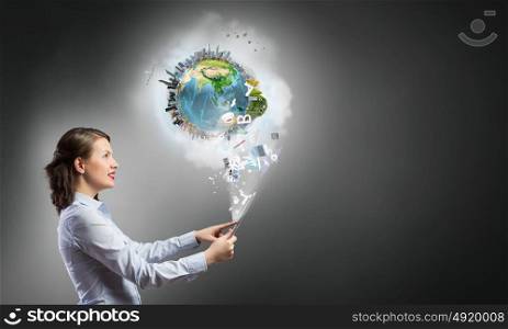 Technologies that connect the world. Young woman presenting earth globe in modern tablet. Elements of this image are furnished by NASA