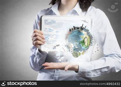 Technologies that connect the world. Young woman presenting earth globe in modern tablet. Elements of this image are furnished by NASA