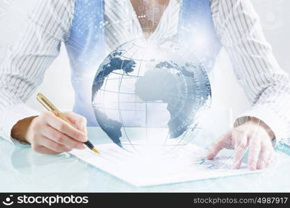 Technologies to connect the world. Close view of businesswoman writing with pen and global connection concept