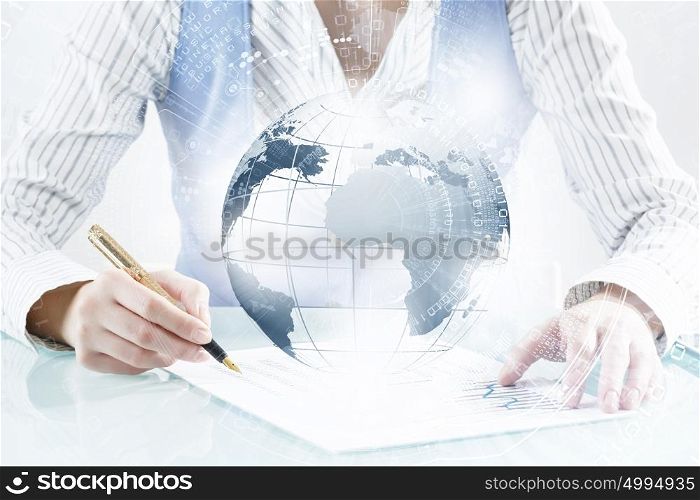 Technologies to connect the world. Close view of businesswoman writing with pen and global connection concept