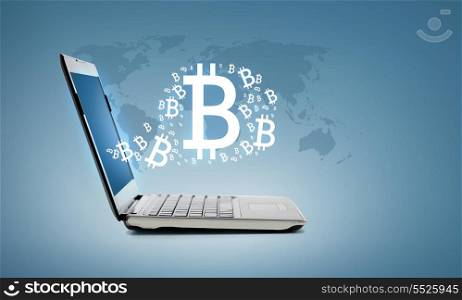 technology and advertisement concept - laptop computer with bitcoin