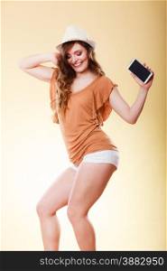 Technology and communication. Attractive summer woman using mobile phone holding smartphone dancing bright background