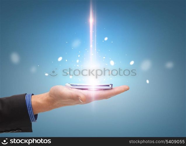 technology and communication concept - close up of man hand with smartphone