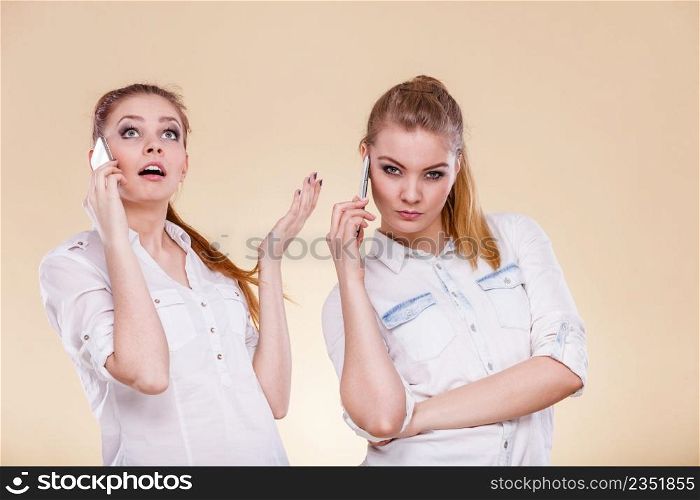 Technology and communication. Lovely teen girls using mobile phones talking, Human emotion, reaction and relationship.. Girls using mobile phone talking