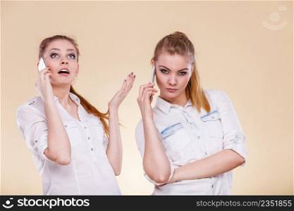 Technology and communication. Lovely teen girls using mobile phones talking, Human emotion, reaction and relationship.. Girls using mobile phone talking