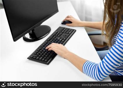 technology and education concept - close up of teenage girl with computer at home. close up of teenage girl with computer at home