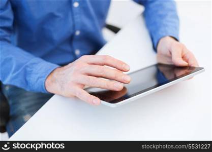 technology and internet concept - close up of male hands working with tablet pc computer