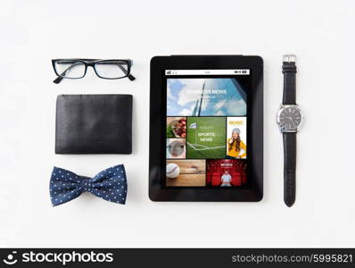 technology and objects concept - tablet pc computer with internet applications , wallet, eyeglasses, bowtie and wristwatch on table