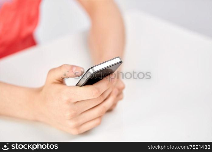 technology and people concept - close up of female hands with smartphone. close up of female hands with smartphone