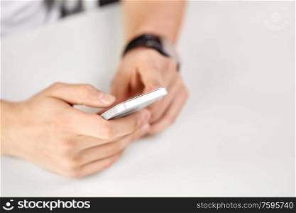 technology and people concept - close up of male hands with smartphone. close up of male hands with smartphone