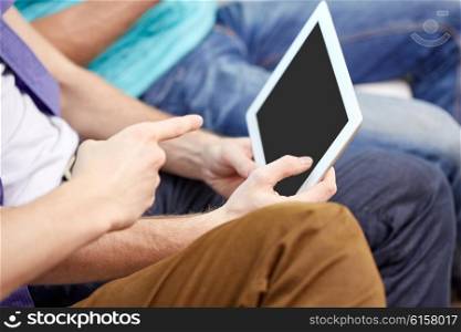 technology and people concept - close up of male hands with tablet pc computer blank screen at home. close up of male hands with tablet pc at home