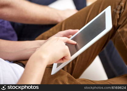 technology and people concept - close up of male hands with tablet pc computer blank screen at home. close up of male hands with tablet pc at home
