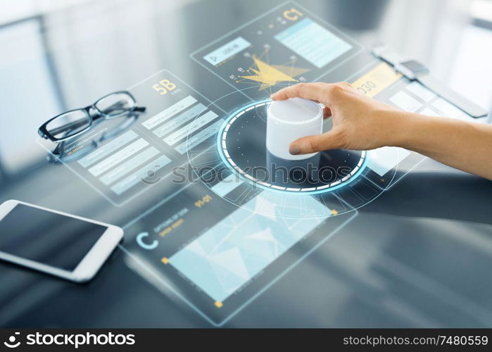 technology and people concept - close up of woman&rsquo;s hand using rotary control knob on interactive panel with virtual data hologram. hand with control knob on interactive panel