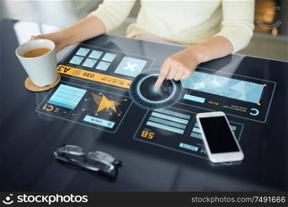 technology and people concept - close up of woman using interactive panel with virtual data and drinking coffee. woman using interactive panel with data