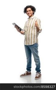technology and people concept - happy young man in glasses with tablet pc computer showing thumbs up gesture over white background. happy young man with tablet pc showing thumbs up