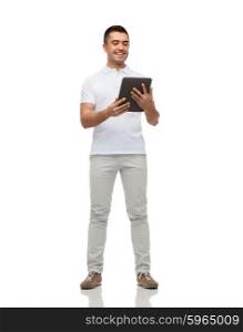 technology and people concept - smiling man with tablet pc computer. smiling man with tablet pc computer
