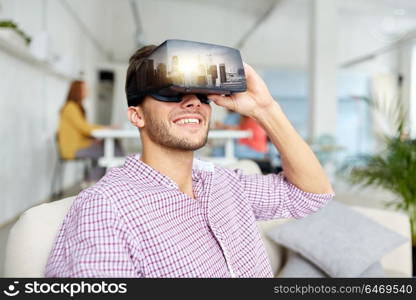 technology, augmented reality and people concept - happy man with singapore city on virtual headset screen at office. happy man with virtual reality headset at office