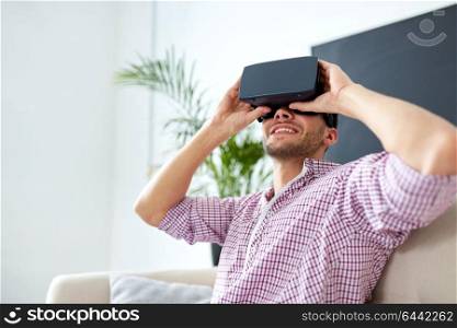 technology, augmented reality and people concept - happy man with virtual headset at office. happy man with virtual reality headset at office