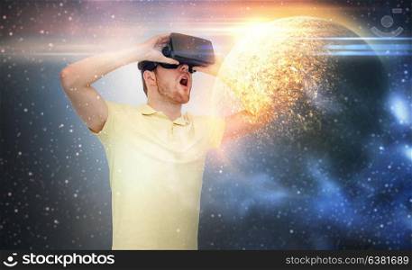 technology, augmented reality and people concept - young man with virtual headset or 3d glasses over planet and space background. man in virtual reality headset or 3d glasses