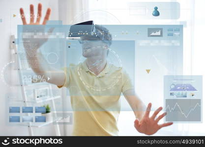 technology, augmented reality, big data and people concept - happy young man with virtual headset or 3d glasses and screens projection at home. young man in virtual reality headset or 3d glasses