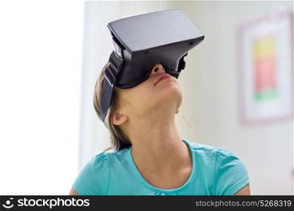 technology, augmented reality, entertainment and people concept - girl with virtual headset or 3d glasses playing at home. happy girl in vr headset or 3d glasses at home