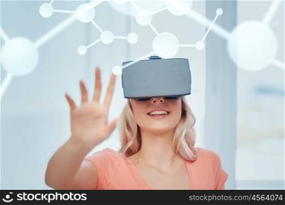 technology, augmented reality, entertainment and people concept - happy young woman with virtual headset or 3d glasses at home looking at projection of molecule