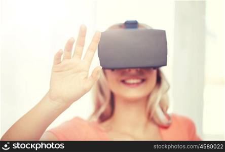 technology, augmented reality, entertainment and people concept - happy young woman with virtual reality headset or 3d glasses touching something invisible. woman in virtual reality headset or 3d glasses. woman in virtual reality headset or 3d glasses