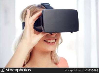 technology, augmented reality, entertainment and people concept - happy young woman with virtual reality headset or 3d glasses