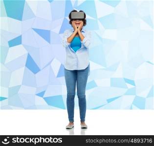 technology, augmented reality, entertainment and people concept - happy young woman with virtual headset or 3d glasses over blue low poly background