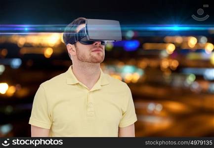 technology, augmented reality, entertainment and people concept - young man with virtual headset or 3d glasses over night lights background. man in virtual reality headset or 3d glasses