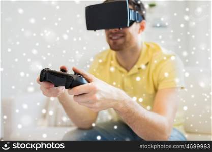 technology, augmented reality, gaming, entertainment and people concept - close up of happy young man with virtual headset or 3d glasses playing video game with controller gamepad at home over snow