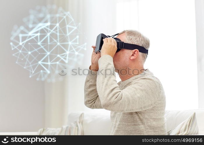 technology, augmented reality, gaming, entertainment and people concept - senior man in virtual headset or 3d glasses with low poly projection at home. old man in virtual reality headset or 3d glasses