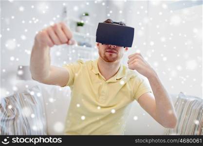 technology, augmented reality, gaming, entertainment and people concept - young man with virtual headset or 3d glasses playing combat game and fighting. young man in virtual reality headset or 3d glasses