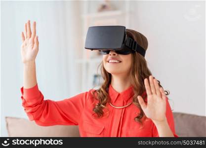 technology, augmented reality, gaming, entertainment and people concept - young man with virtual headset or 3d glasses playing videogame at home. happy woman in virtual reality headset at home