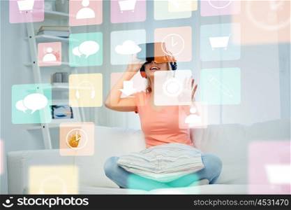 technology, augmented reality, multimedia and people concept - happy young woman in virtual headset or 3d glasses and headphones playing game at home looking at menu icons
