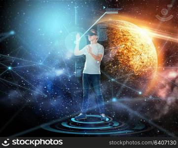 technology, augmented reality, network and people concept - young man with virtual headset or 3d glasses over planet and space background. man in virtual reality headset or 3d glasses